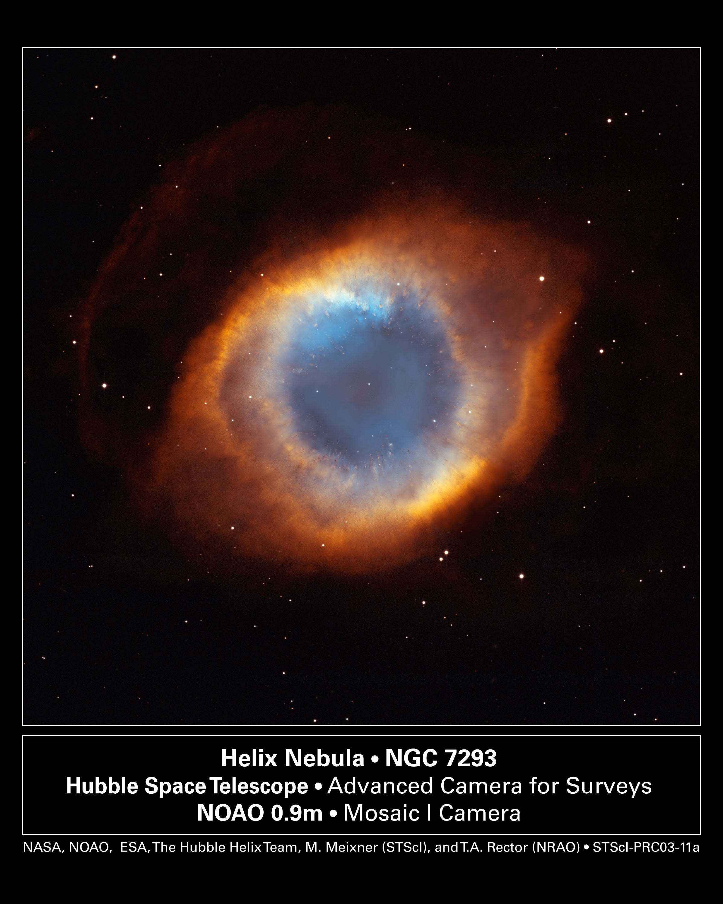 Hubble and WIYN composite image of the Helix Nebula (NGC 7293) — a colorful ring of glowing gas surrounding a dying white dwarf star