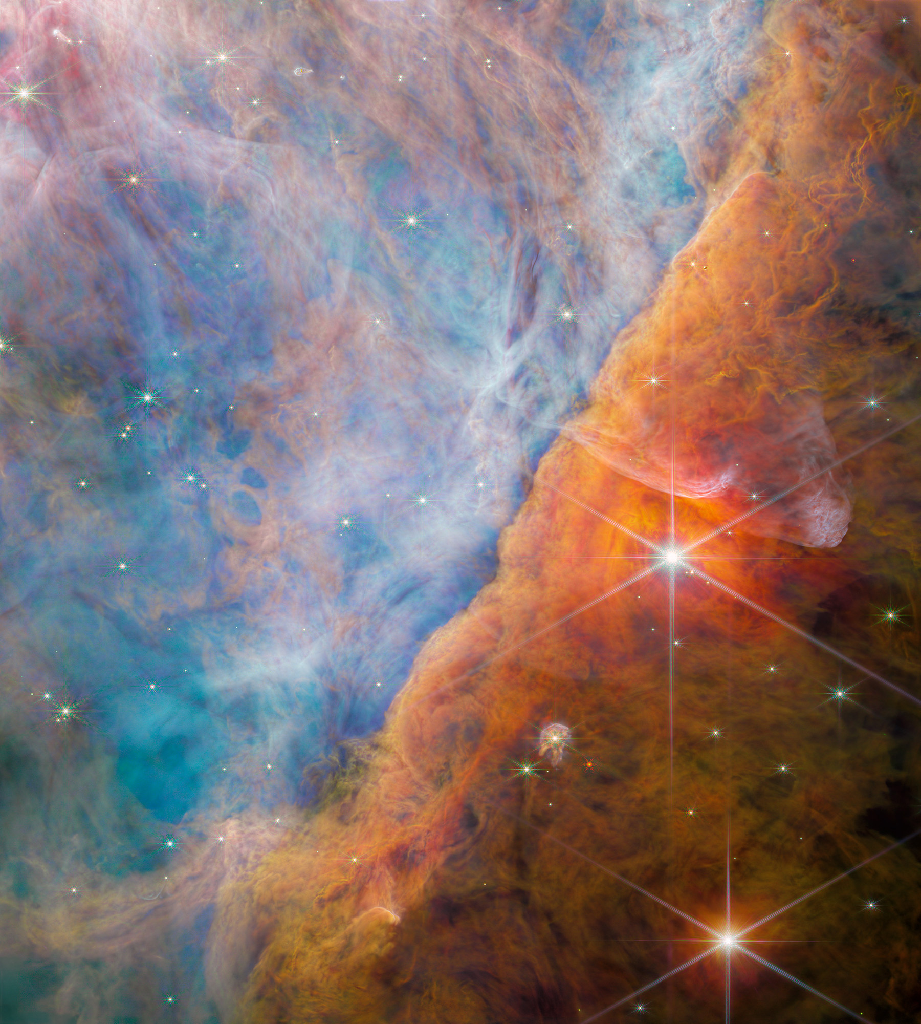 The Orion Bar, a bright ridge of ionised gas within the Orion Nebula (M42), imaged by NASA's James Webb Space Telescope in near-infrared