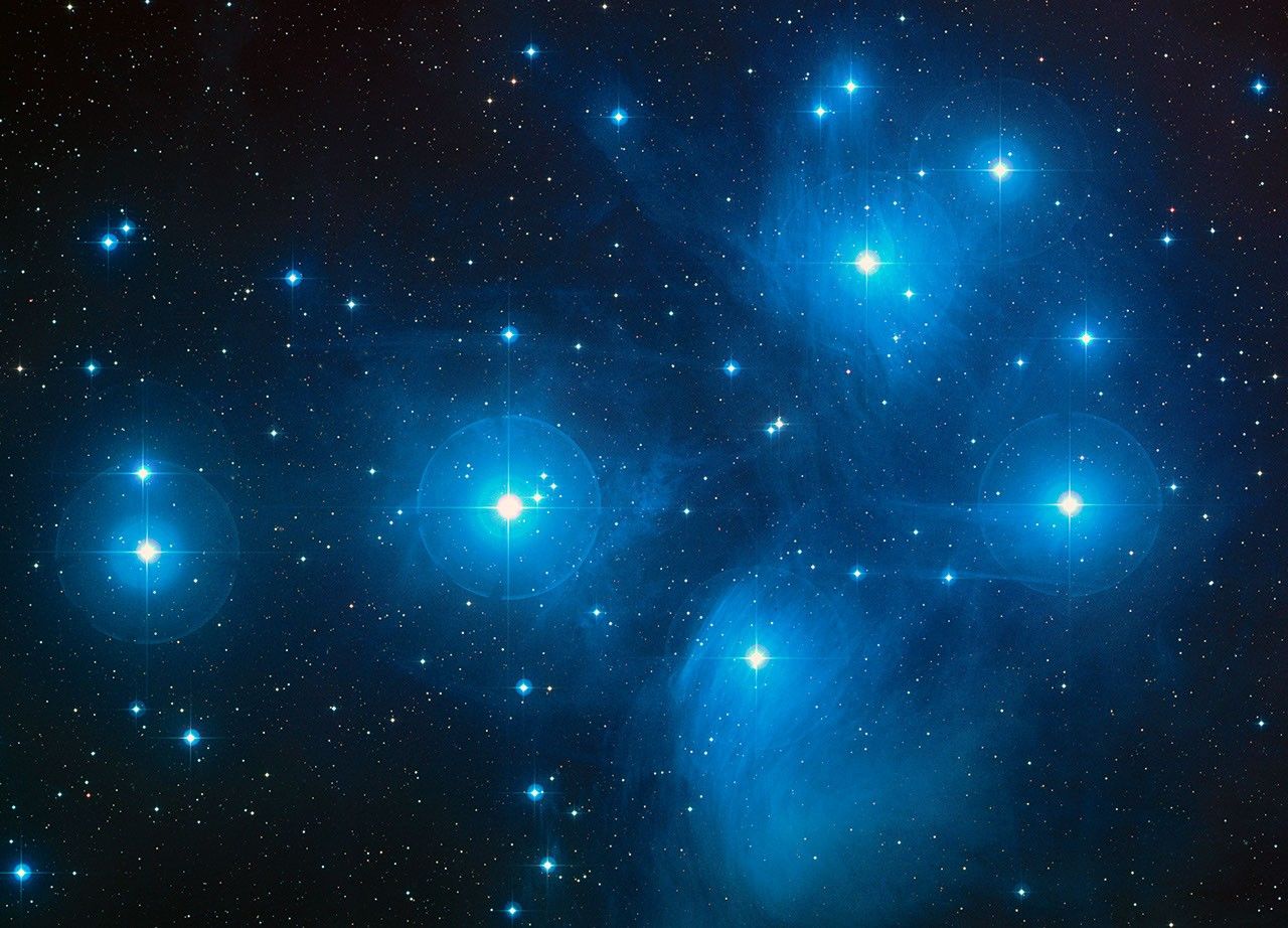 The Pleiades open star cluster (M45), a color composite from the Palomar Observatory Sky Survey overlaid with the Hubble Fine Guidance Sensors' field of view